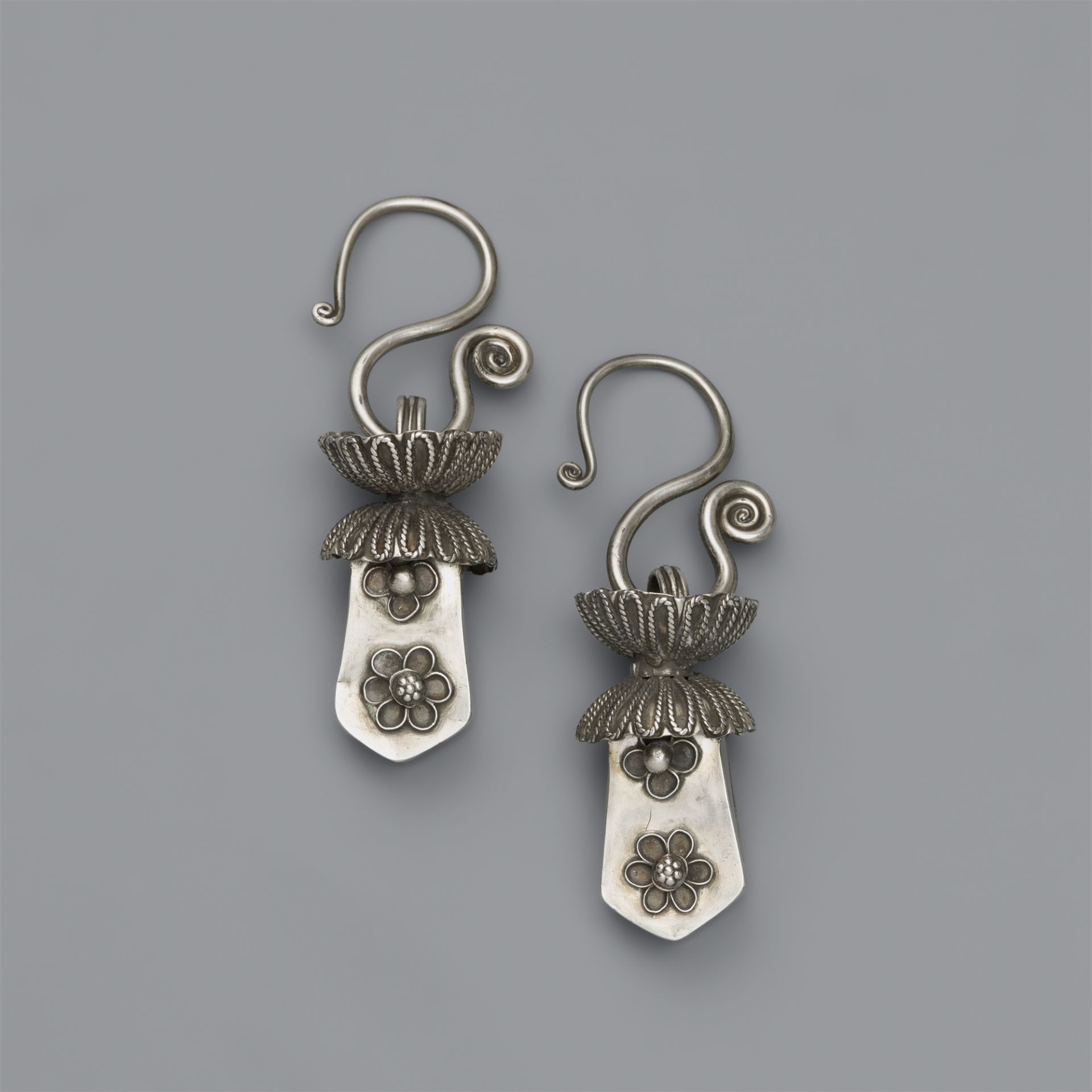 A pair of ear hangings. Southern China, Guizhou province. Miao and Dong tribes. Mid-20th century