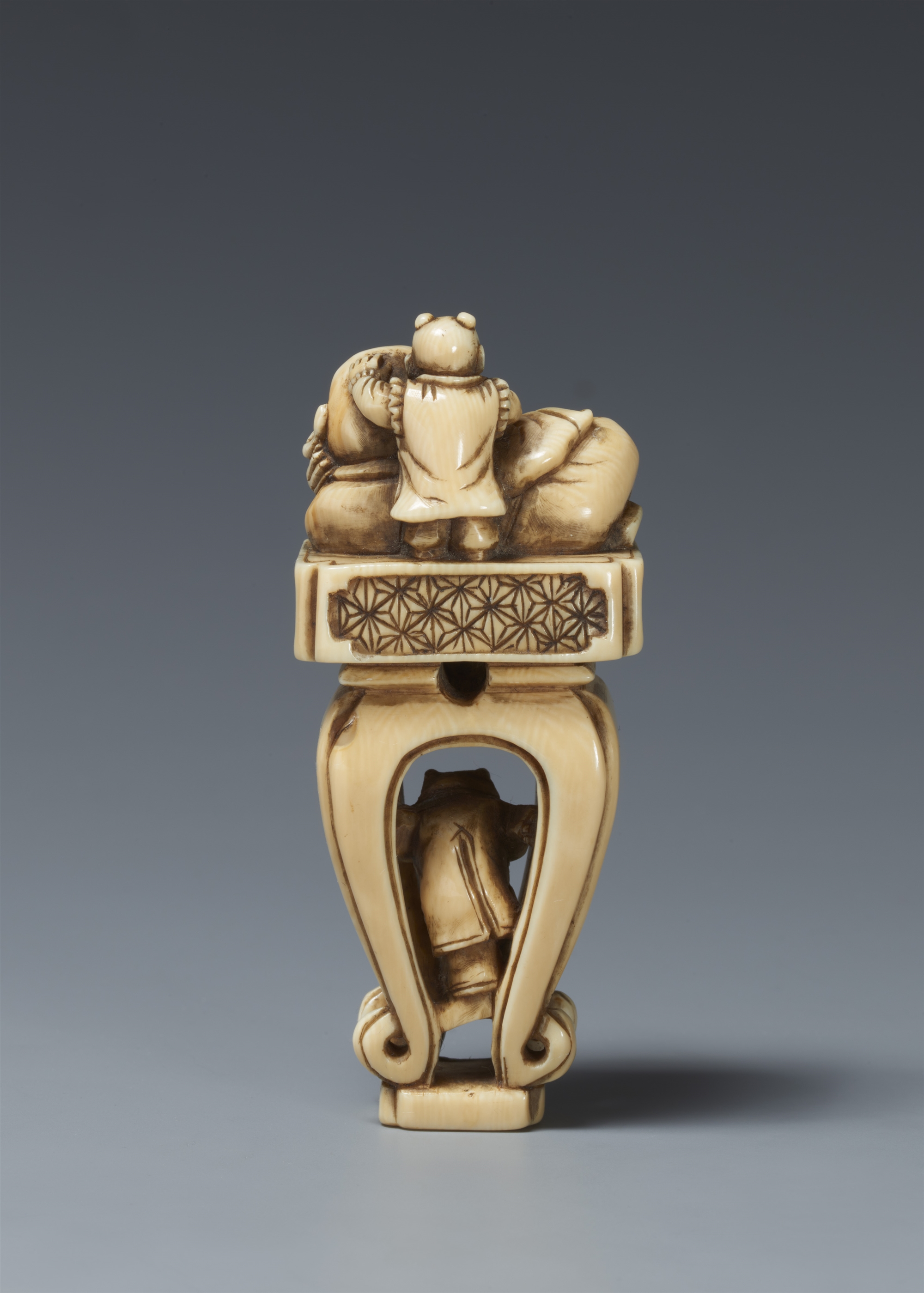 An ivory netsuke of Hotei on a high Chinese-style table. 19th century - Image 5 of 5