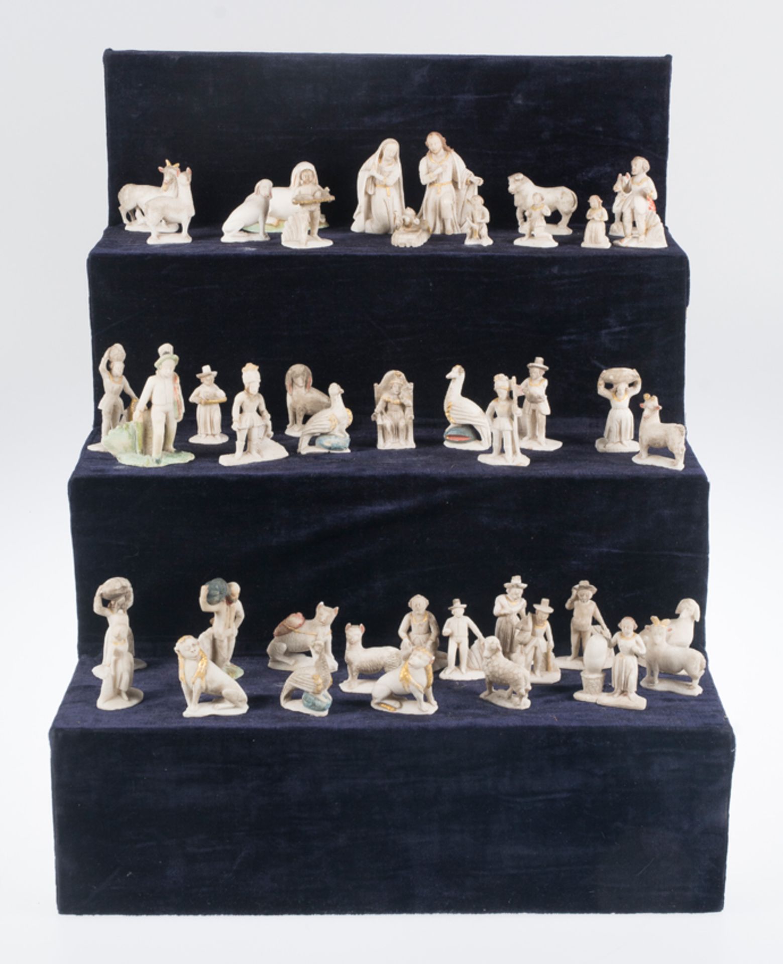 Imposing set of 44 sculpted huamanga stone figures that form a Nativity scene. Peru. 18th century.