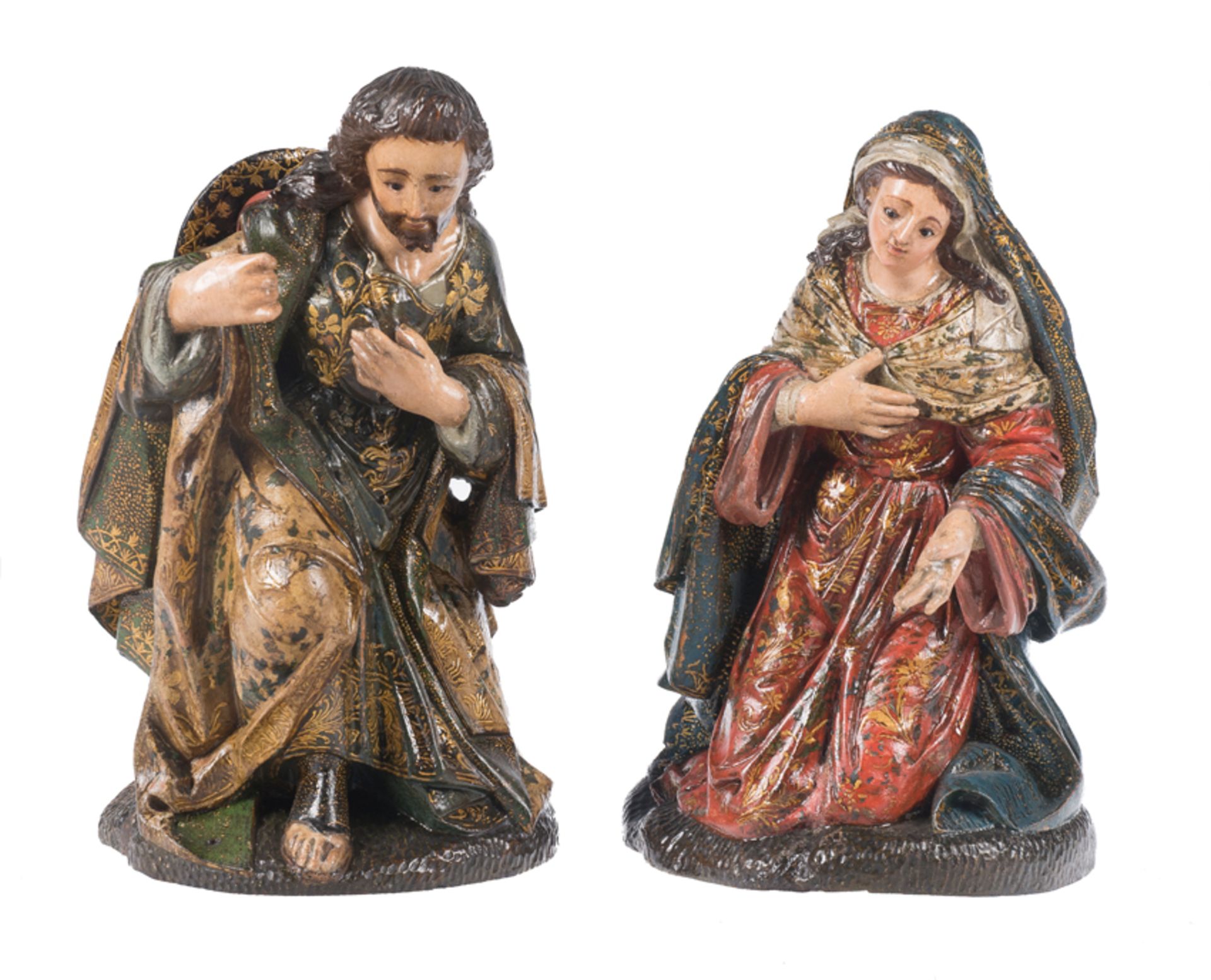 "The Virgin Mary and Saint Joseph". Pair of carved and polychromed wooden sculptures. Quito. 18th c