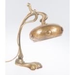 Gilded bronze and martelé tin table lamp. France. Art Nouveau. Circa 1900.