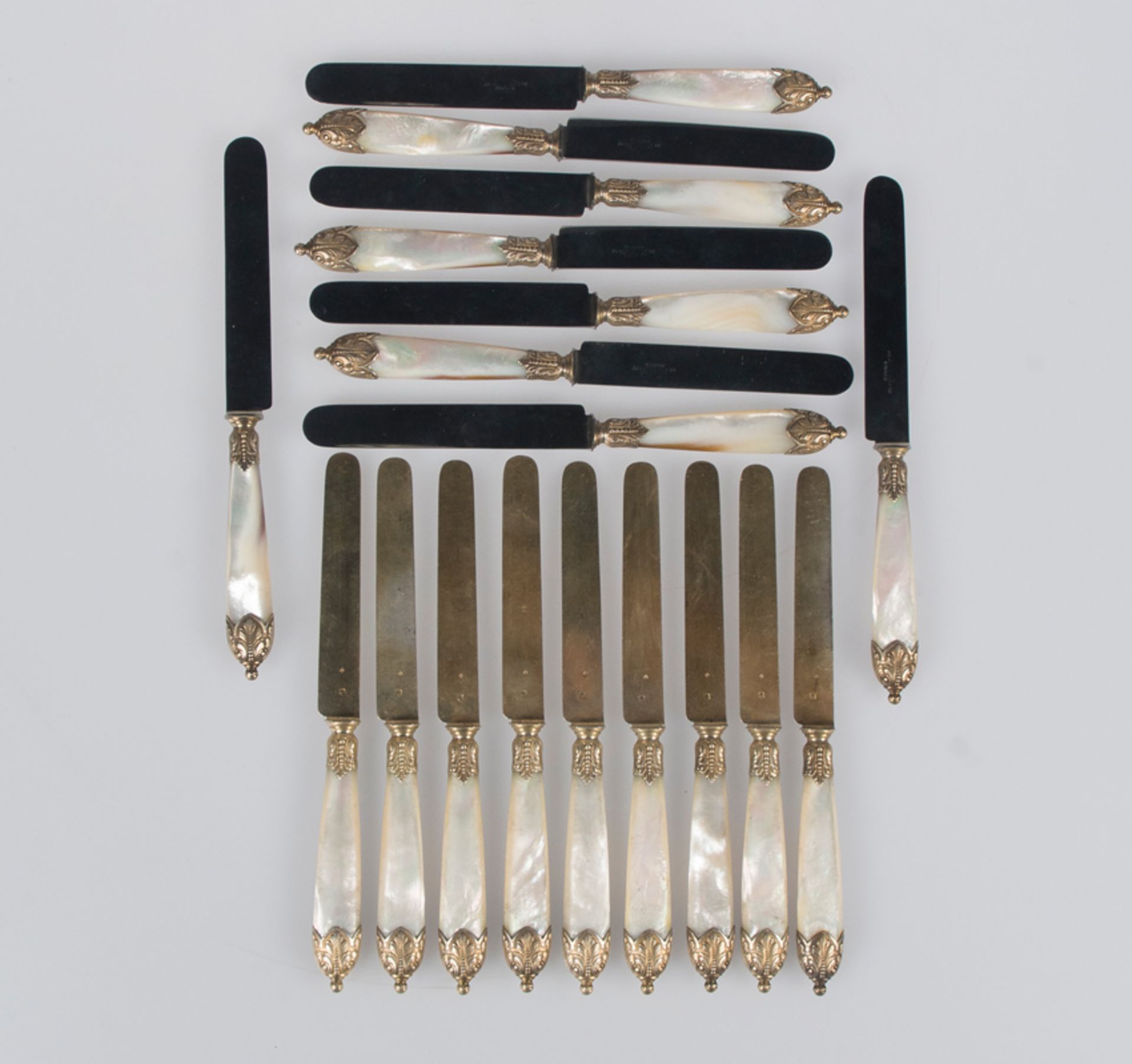 A set of 9 mother-of-pearl and vermeil silver knives. J.Fel. Paris.