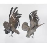 Pair of large embossed and chased silver roosters. Colonial work.Possibly Peru. 19th century
