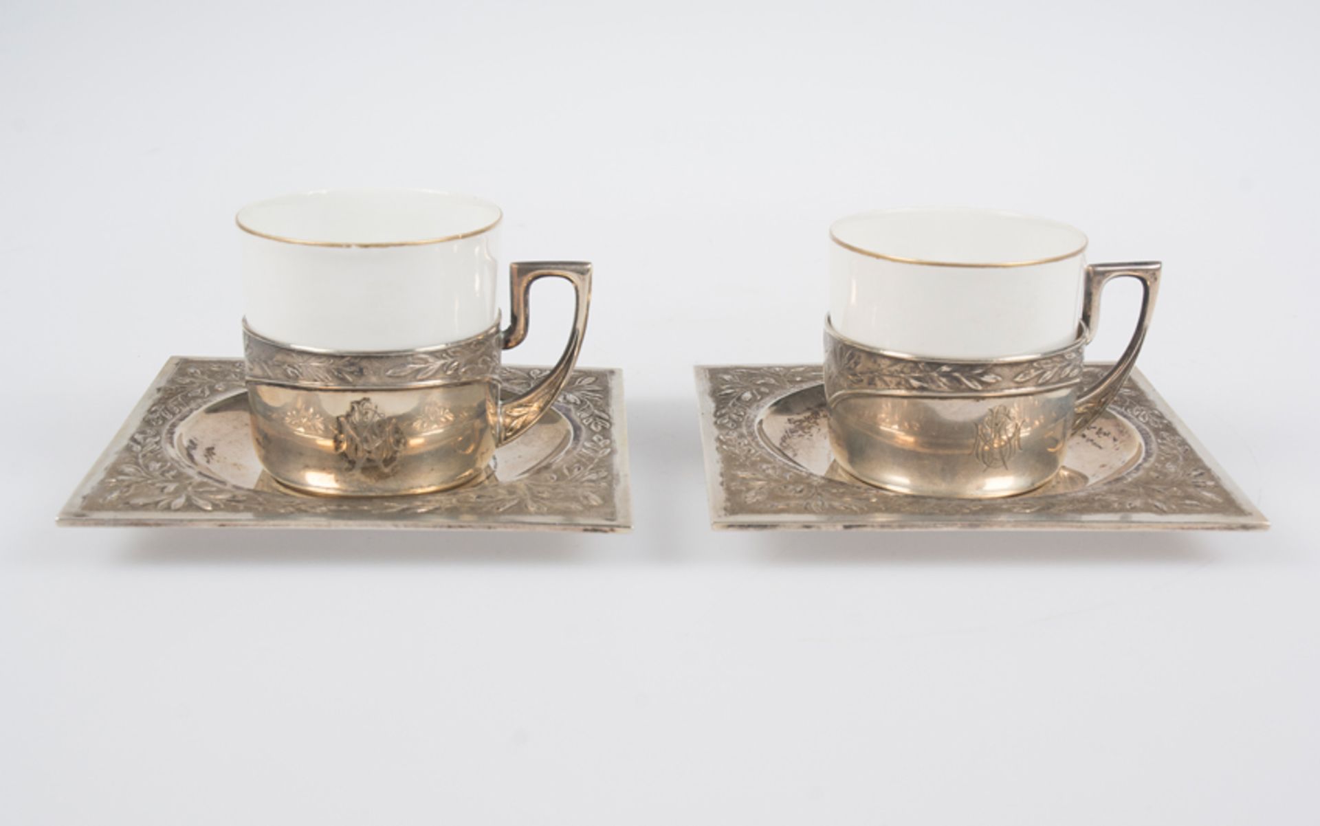 Pair of "mancerinas", a silver and opaline cups. Barcelona. Marked Masriera and LBB.
