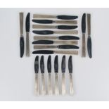 Set of 12 marked silver dining knives and 12 dessert knives. Circa 1950.