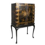 Lacquered wooden cabinet with gilded iron fittings. China. 19th century.