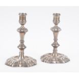 Pair of marked English silver candlesticks. London. 18th century.