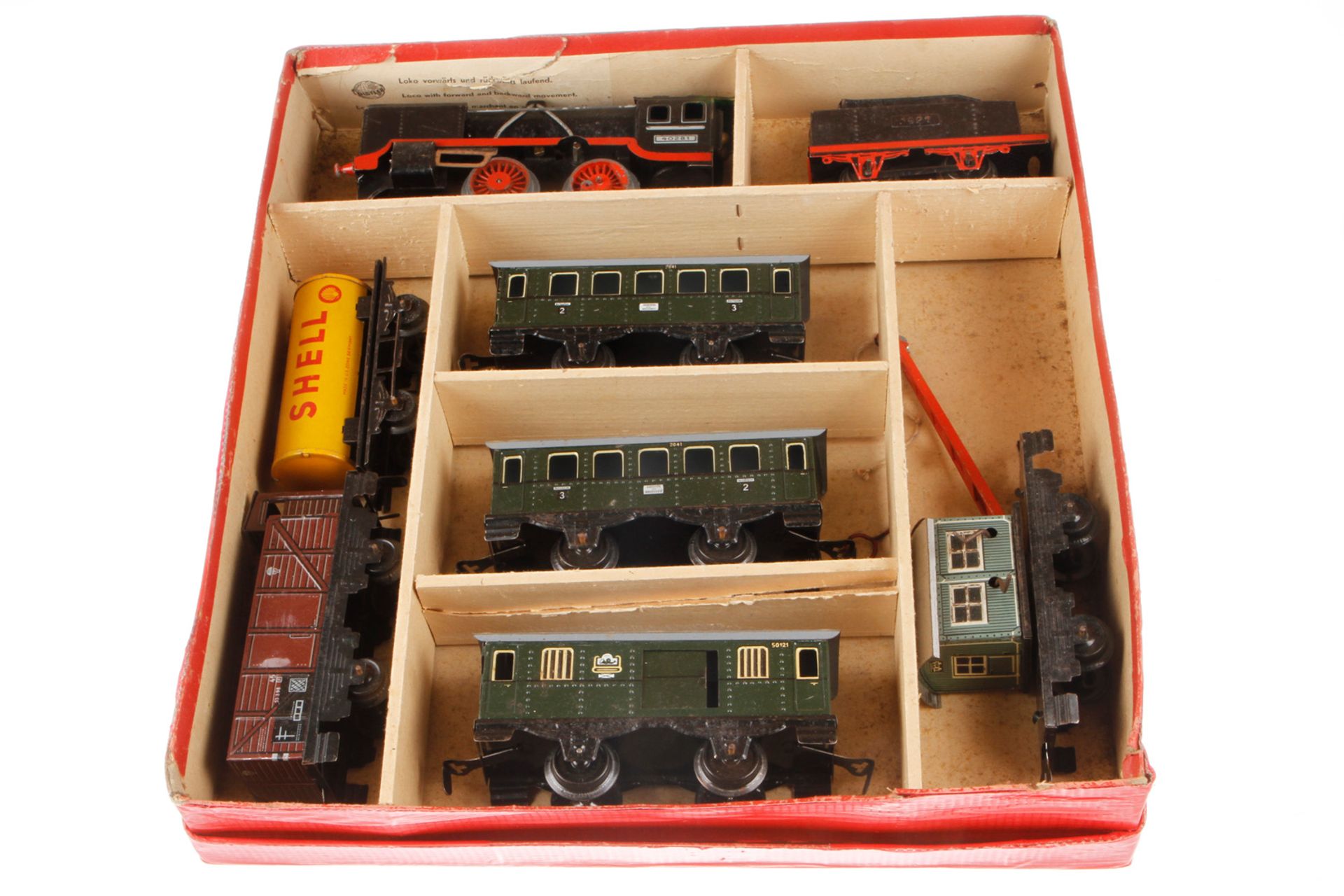 Distler Zugpackung, Spur 0, mit Lok, Tender und 6 versch. Wagen, Uhrwerk intakt, NV, LS, im rest.