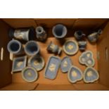 A collection of blue Wedgwood Jasperware to include vases, urns, pin dishes in various shapes etc (