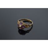 Victorian 12ct gold ladies ring set with a seed pearl and amethyst stones. 1.7 grams. UK size O.