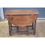 An 18th century thick oak dropleaf gateleg table. 116 x 101 x 77cm tall when extended. In good