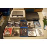 A boxed Playstation 2 Slim together with a PS3 and some PS3 games to include COD MW3, Assassins