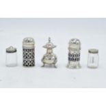 A collection of silver cruets and a near pair of sterling silver topped glass cruets (5).