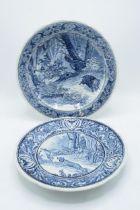 A pair of Delfts blue and white wall chargers depicting country and hunting scenes. 'Made for