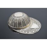 A novelty silver caddy spoon in the form of a jockey's hat. 11.1 grams. 5cm long. Sheffield 1979.