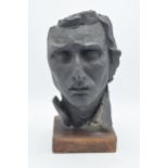 A 20th century studio-made bust of a gentleman mounted on a wooden base. 34m tall.