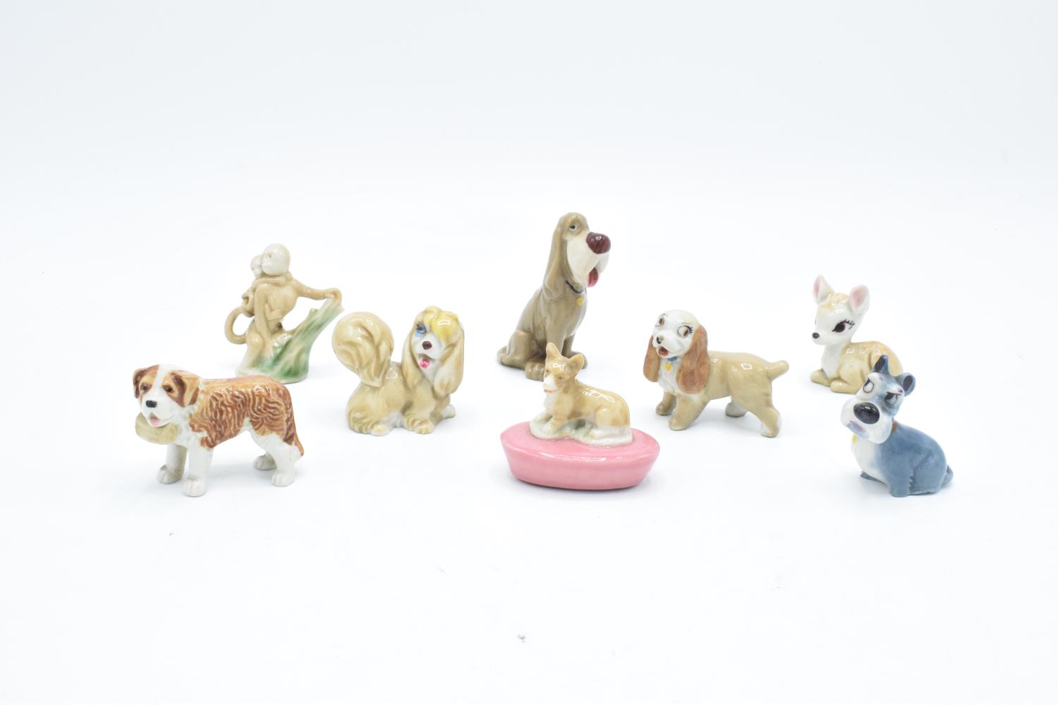 A collection of Wade to include a corgi pen holder, dog with basket, 2 monkeys, Peg, Lady, Jock,