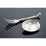 A Dutch silver travelling spoon / fork which folds to change its use. 43.2 grams. Hallmarks present.