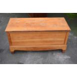 An early 20th century blanket box with detachable lid made from the base of a wardrobe with