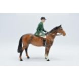 Beswick huntsman on brown horse wearing a green jacket 1501. In good condition with no obvious