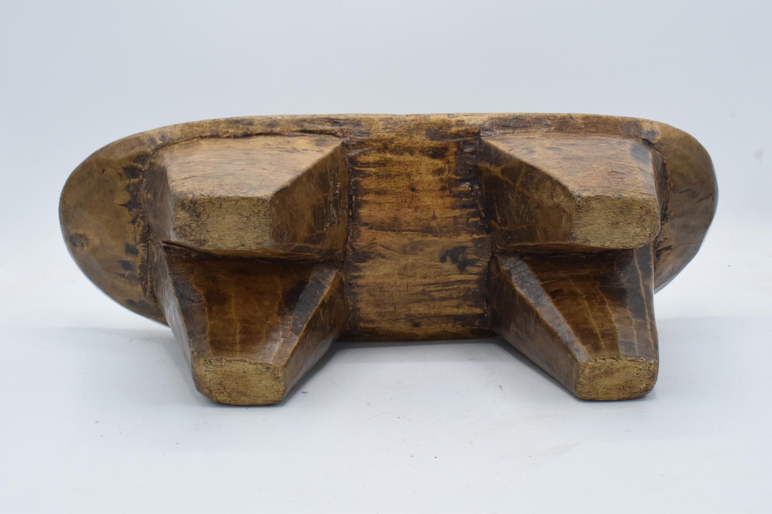 An early to mid 20th carved wooden headrest, believed to be of African origin. 43cm long. - Image 3 of 3