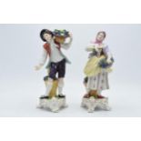 A pair of Rudolf Kammer continental porcelain figures of grape pickers (2). In good condition with