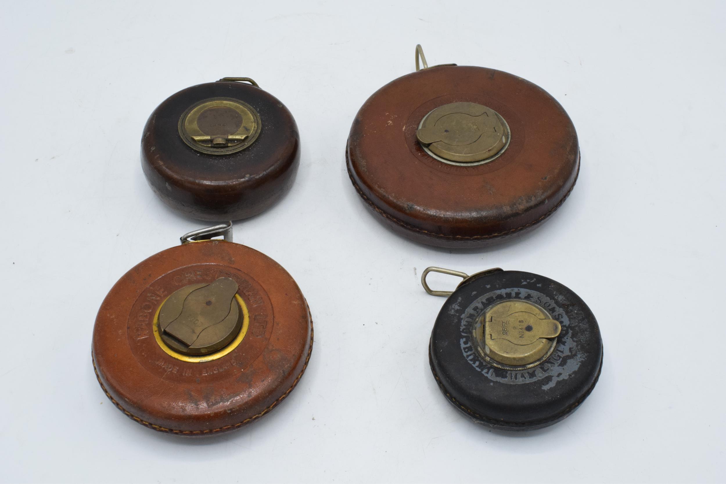 A collection of tape measures with steel tape including Chesterman, Sheffield 25 foot, Rabone