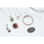 A collection of silver jewellery to include brooches, chains, pendants etc. Gross weight 73.7 grams.