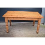 A late 20th century thick pine topped kitchen table. 152 x 89 x 78cm tall. In good functional