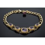 9ct gold bracelet set with amethyst stones. 24.6 grams. Approximate length 25cm.