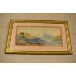 A framed watercolour of a lake scene, believed to be continental, unsigned. 47 x 28cm inc frame.