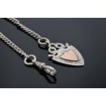 A hallmarked silver Albert chain with a silver fob. 25.3 grams. Hallmark to each link. 34cm long.