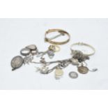 A collection of silver and silver coloured jewellery to include 9ct on silver items, bangles, chains