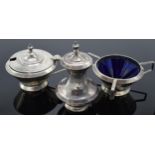 A matched cruet set to include a pepper pot and 2 condiment pots (3). 74.7 grams of silver.