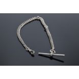 A hallmarked silver Albert watch chain with T bar. 27.4 grams. Hallmark to each link. 32cm long.