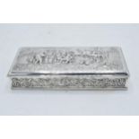 Dutch silver cigarette box with repoussé decoration of a tavern scene. 18 x 8cm.