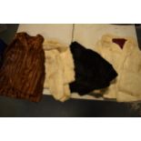 A large collection of fur coats of varying lengths and similar items by various makers such as