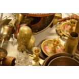 A good collection of brass and copper to include a cow bell, shell cases, a Churchill brass bust,