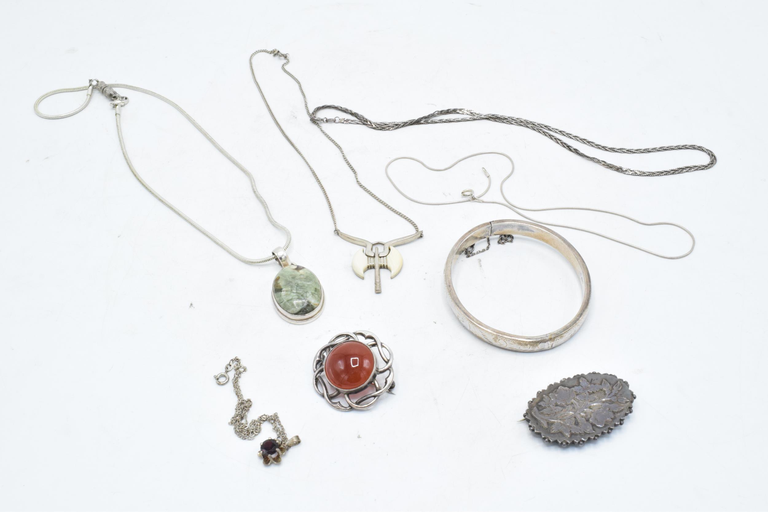 A collection of silver jewellery to include brooches, chains, pendants etc. Gross weight 73.7 grams. - Image 2 of 2