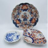 A collection of oriental pottery to include 19th century Japanese items such as a shell shaped Imari