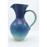 A large Usch Spettigue studio pottery jug. 'SP' impressed to base. 30cm tall. In good condition with