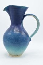 A large Usch Spettigue studio pottery jug. 'SP' impressed to base. 30cm tall. In good condition with