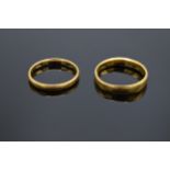 A pair of 22ct gold wedding bands. 6.8 grams.