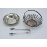 A collection of silver items to include a pair of tongs Sheffield 1924, a silver dish Birmingham