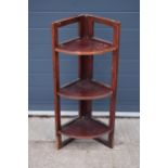 A wooden free-standing corner display / shelving unit - ideal for antiques fairs and markets etc.