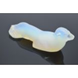 A boxed collection of Art Deco opalescent knife rests in the form of sea lions by Danielo of