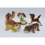 A collection of comical Weatherby pottery Zookie figures to include a sausage dog, a puppy, a