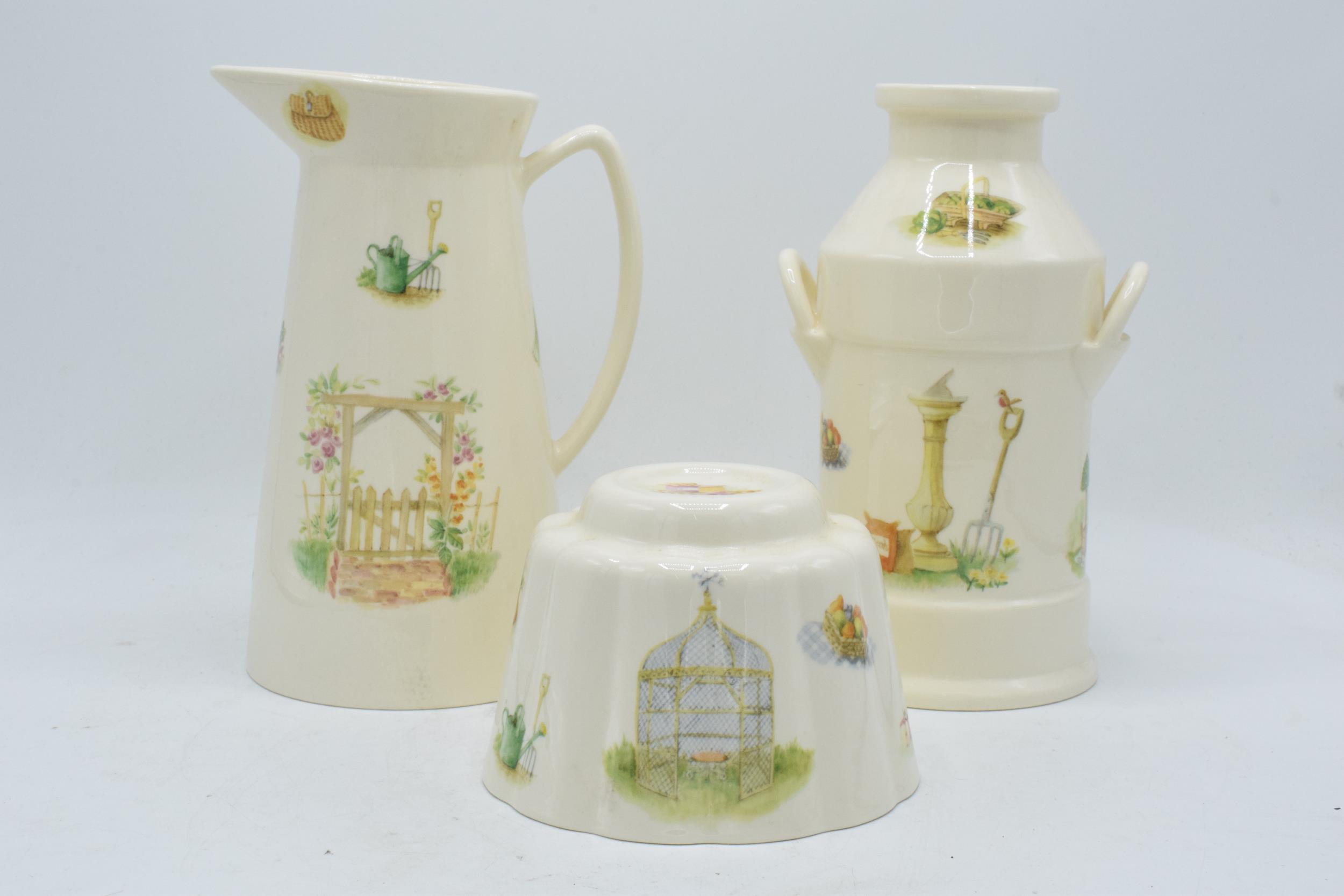 A collection of Aynsley Edwardian Kitchen Garden items to include a tall jug, a milk churn and a