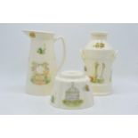 A collection of Aynsley Edwardian Kitchen Garden items to include a tall jug, a milk churn and a