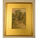 A framed watercolour of a man walking his horse with a child through a woodland path. Signed by H